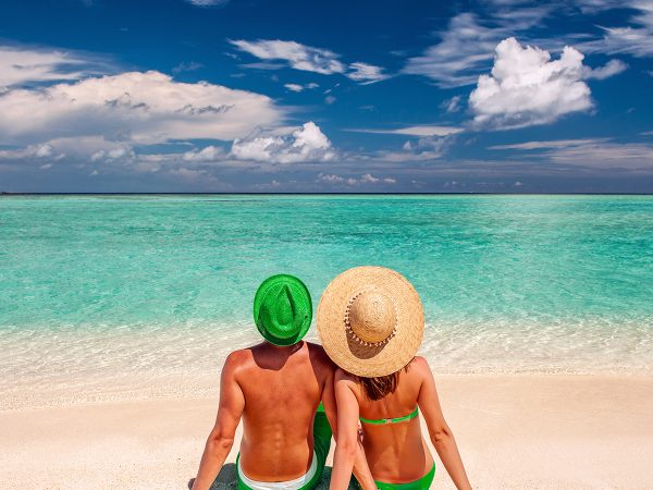 couple-on-a-beach-at-maldives-PS6C3MA.jpg